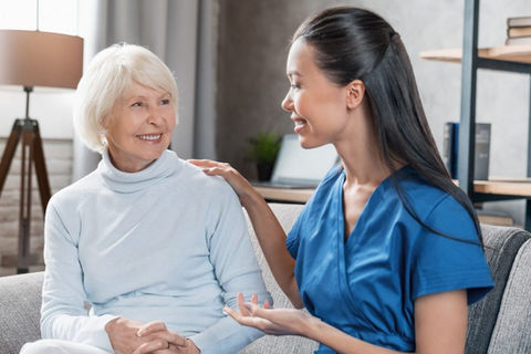 nurse-assisting-with-elderly-woman-at-home-e1666615469175.jpg