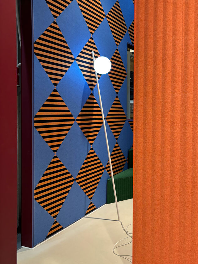 Geometric patterned wall with partial view of curtain installation