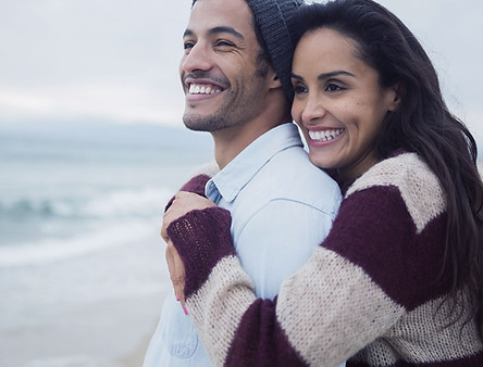 Couple hugging at the beach