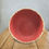 Thumbnail: rust red paper mache bowl with raffia stitched rim