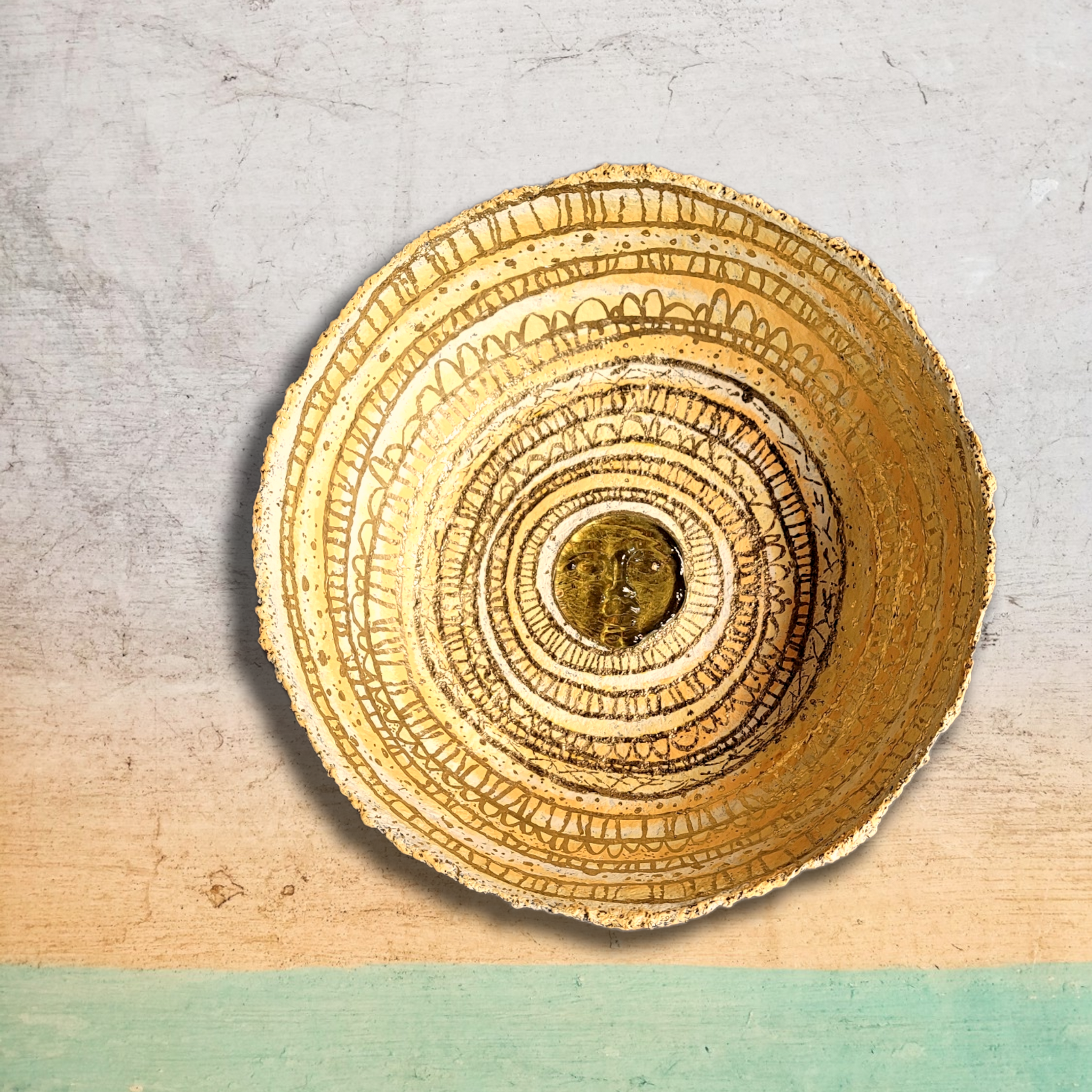 large yellow paper mache and glass sun bowl