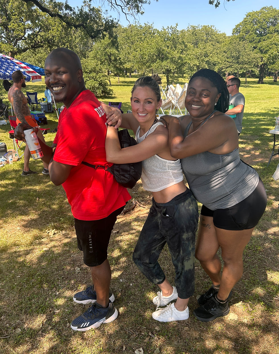 Nisa with two friends leaning on each other in athletic attire at the Epic Games II event in May 2026