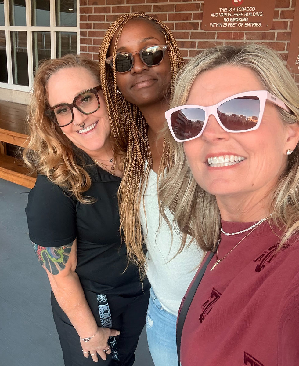 Dawn LaQuay, Women's Program Manager stand on the left side with Winnie B., Women's Liaison in the middle and supporter Kim F. on the right side.