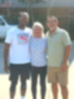 Marsha posing with two Residents who helped her move.