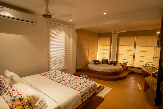 Spacious Paradise Suite bedroom with ocean-facing round bed at Villa Vara.