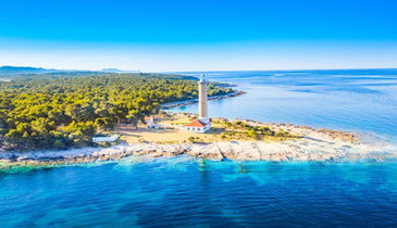 Luxury boat navigating along rocky coast of Dugi Otok