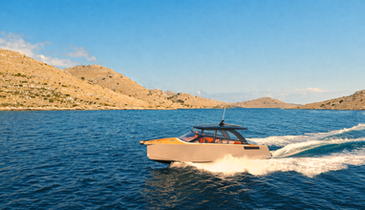 Luxury motorboat cruising through the Kornati islands with rocky coastline and turquoise sea