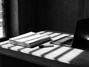 A stack of consultation documents on a desk, illustrating the FCA and Bank of England tokenisation feedback statement