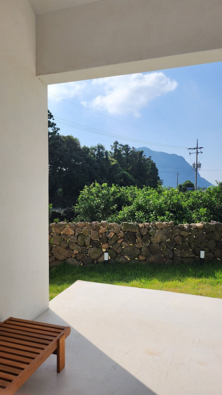 Wooden house in a tangerine orchard