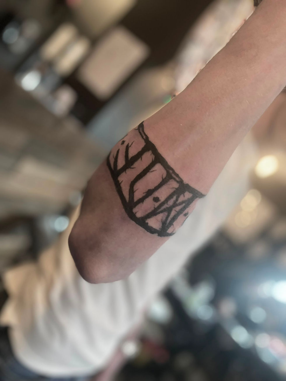 Rune arm Band tattoo from a London Viking tattoo artist