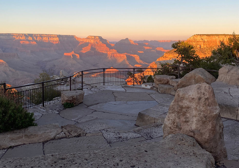 A sunset view from a small stone amphitheater along the South Rim - perfect for a meal with a view! Photo by Alex Alley.