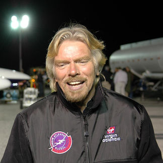 Richard Branson wearing Virgin Atlantic jacket on tarmac