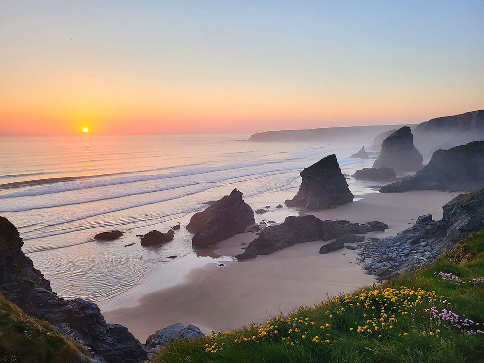 Sunset over a dramatic coastal landscape