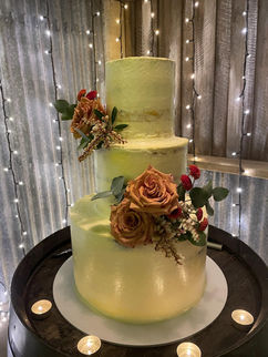 3-tier cake decorated with silk flowers, perfect for weddings or celebration