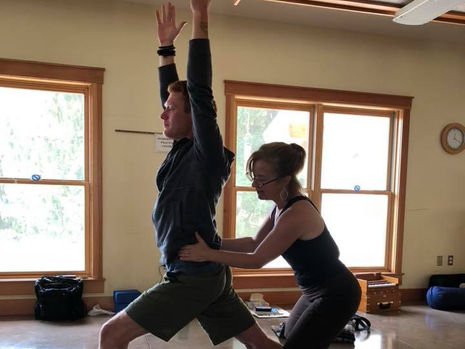 Stephanie Lynn teaching hip posture for warrior
one pose