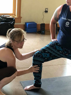 Stephanie Lynn teaching foot position for warrior one pose
