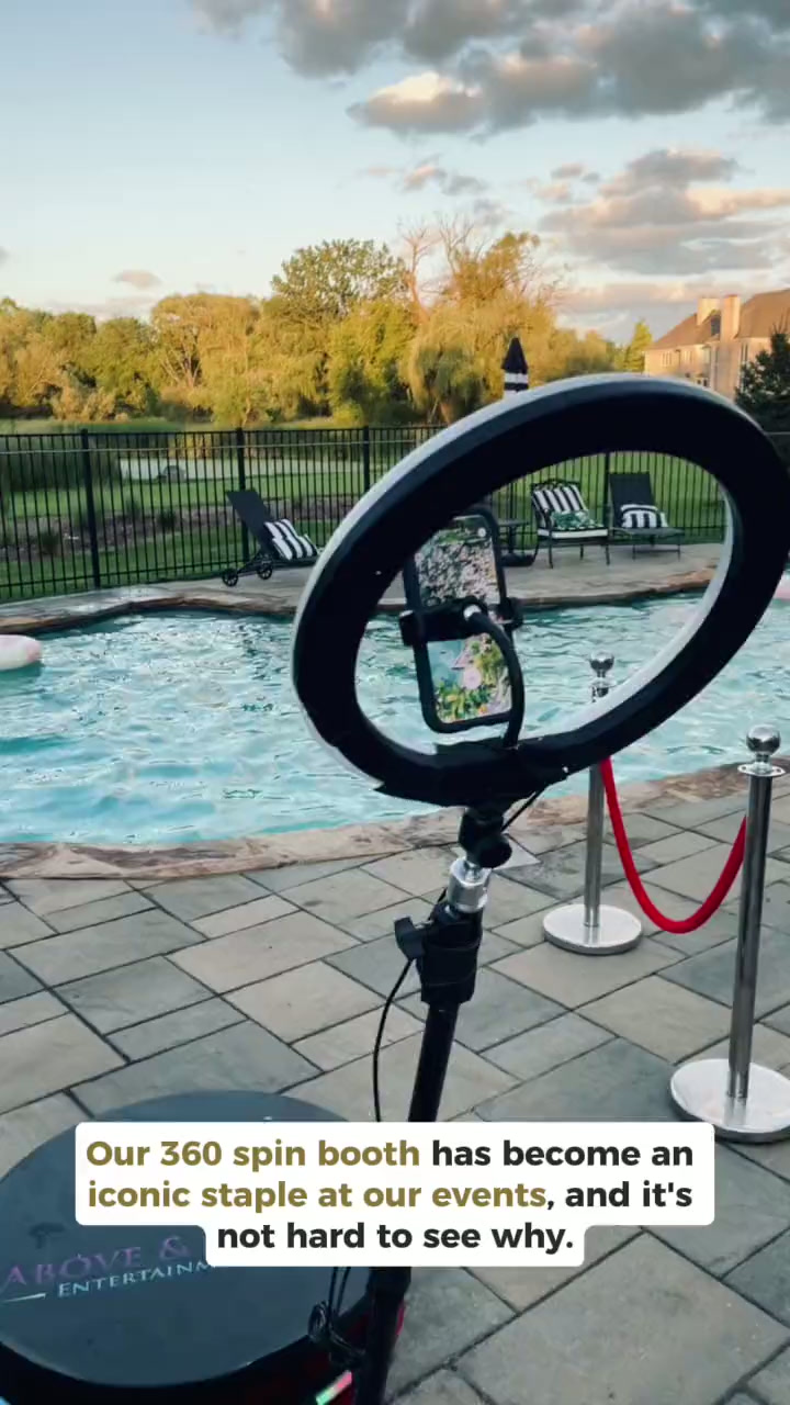 360 spin booth with ring light set up beside a backyard pool