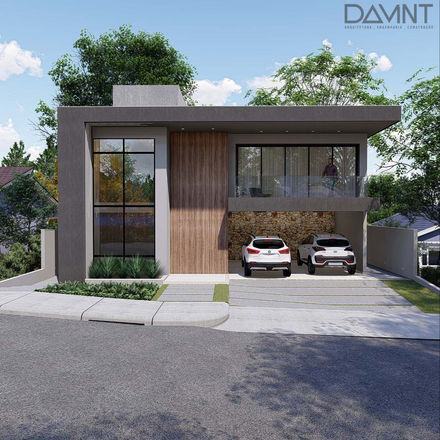 Casa moderna de dois andares com varanda de vidro, garagem de pedra e paisagismo verde elegante.