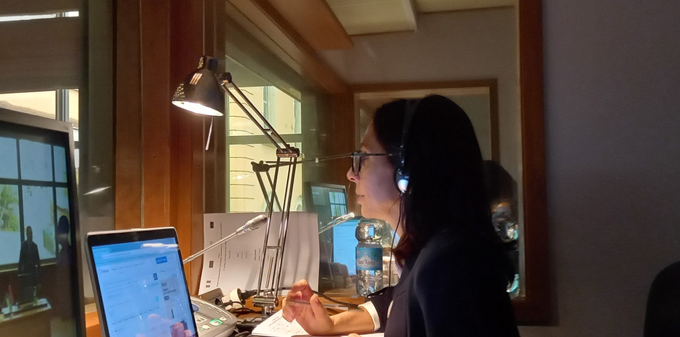 Simultaneous interpreter delivering real-time translation during multilingual event