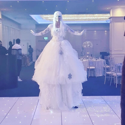 snow queen on stilts