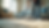 Eye-level view of a professional cleaner vacuuming a carpet in a bright living room