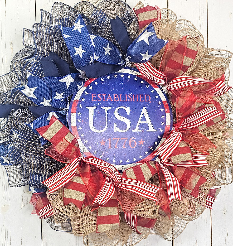 Red white and blue patriotic wreath with stars and stripes ribbon