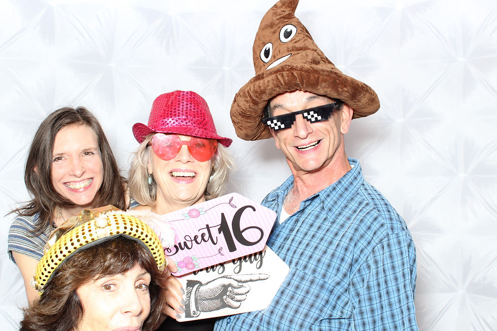 Family having fun with Forever After's photo booth