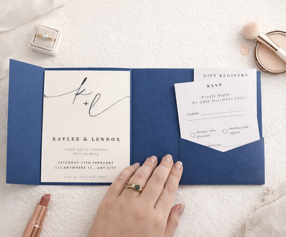 image of a ble bi-fold invitation hand holding the invitation open. it is on a white tetured background.