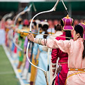 Naadam festival Mongolia archery, Mongolian women in traditional Mongolian dress shooting