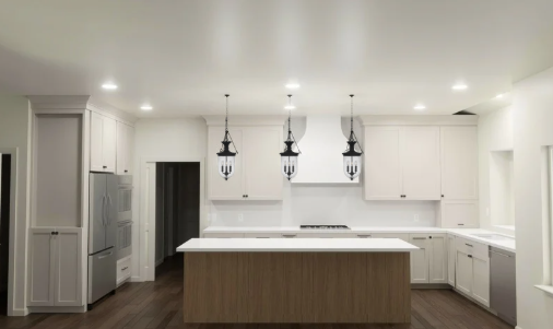 3D rendering of a modern spanish style white kitchen with wood island and pendant lights