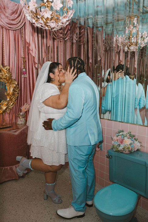 cute portrait of the newlyweds kissing