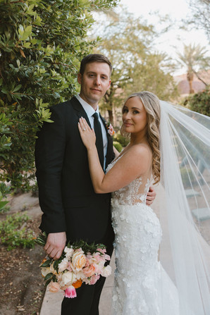 couple smiling at the camera during their bridal portraits