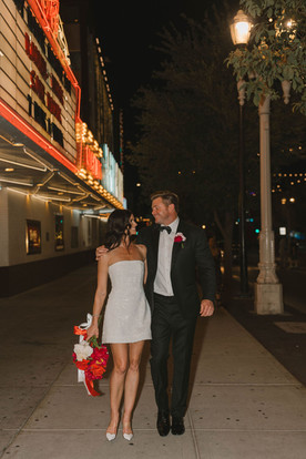 bride and groom laughing with each other during their photoshoot