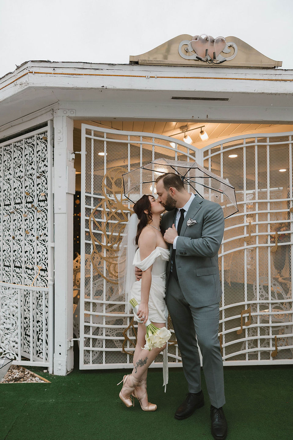portrait of the bride and groom kissing