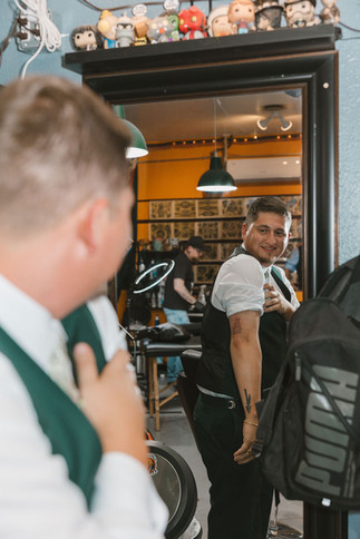 groom getting his new tattoo