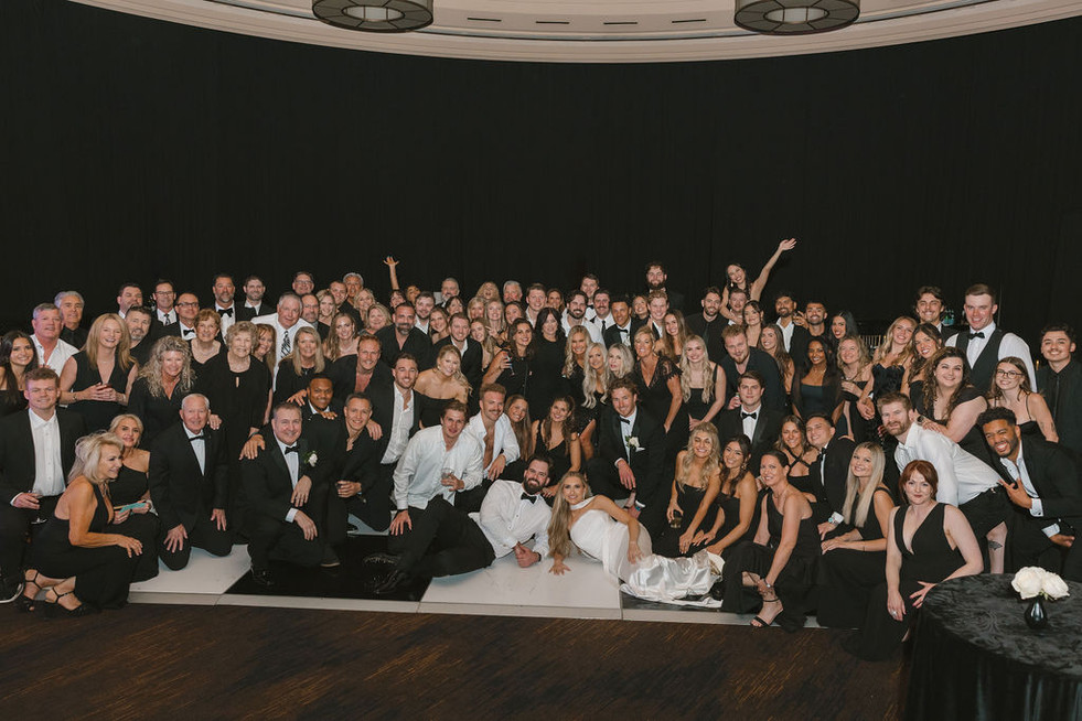 cute picture of the newlyweds and their wedding guests
