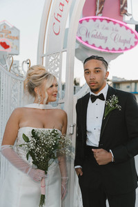 bride and groom smiling at each other