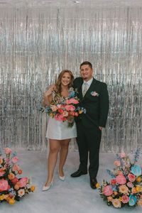 cute couple looking at the camera during their bridal portraits 