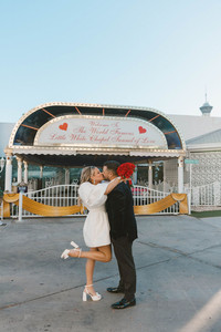 Picture of the bride and groom, kissing