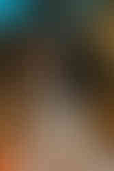 portrait of the newlyweds kissing at their reception party