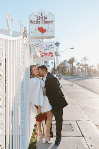 groom kissing the bride on the cheek