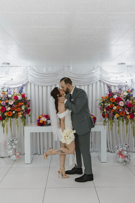 cute portrait of the bride and groom kissing after their ceremony