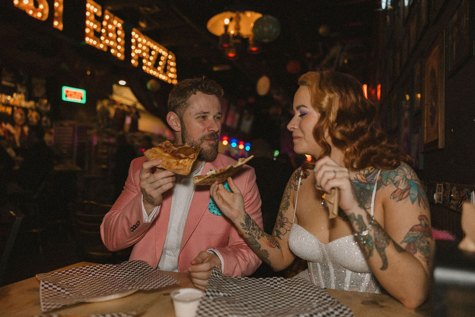 cute picture of the newlyweds eating pizza in las vegas