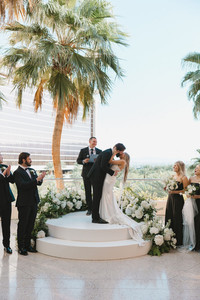newlyweds kissing after their wedding ceremony