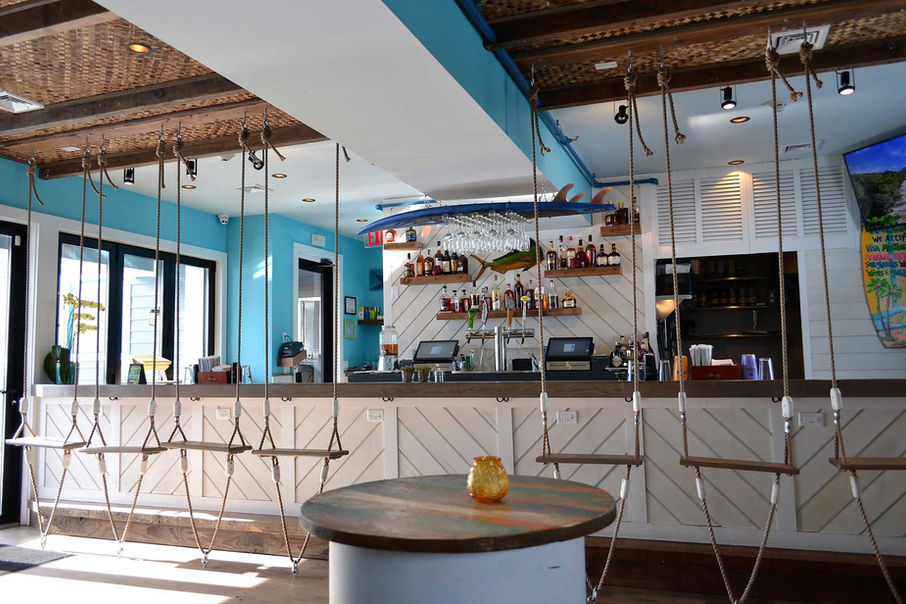 Rhum Restaurant bar with swing seating. 