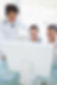 Team of doctors looking at computer screen