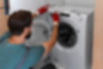 Man installing washer/dryer
