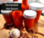 bottles and jars with red hot sauce