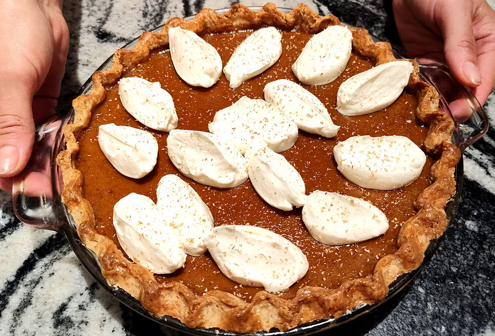 Healthy pumpkin pie with fermented crust and maple-sweetened filling topped with probiotic cream.