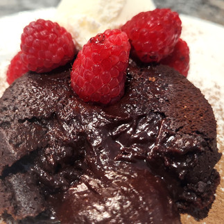 lava cake with raspberries on top